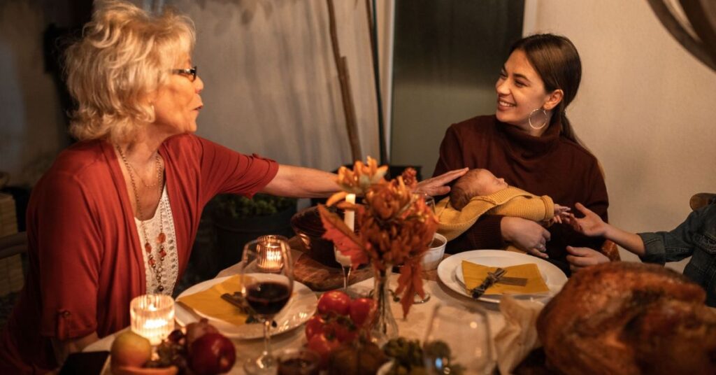 50 Short Thanksgiving Dinner Prayers & Blessings for Family (2026) 2 Child saying a simple Thanksgiving prayer for kids at dinner